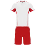 Conjunto deportivo unisex con combinación de tres tejidos, camiseta con cuello mao y apertura mediante broche de presión, interior de la manga en