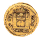 Gold Plated 31 Rue Cambon Coin Brooch