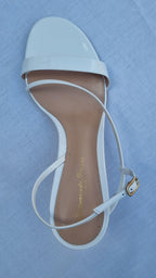 White patent leather strapped heeled sandals