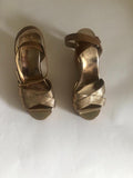 Jimmy Choo Gold Crossover Leather Wedges