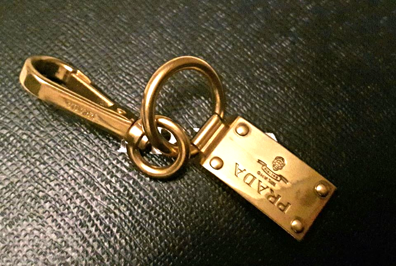 Gold-tone metal logo charm keyring