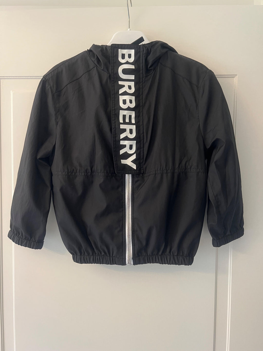 black logo raincoat