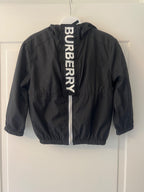 black logo raincoat