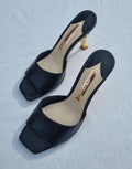 Black leather gold-tone flamingo Flo heeled mules