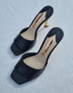 Black leather gold-tone flamingo Flo heeled mules
