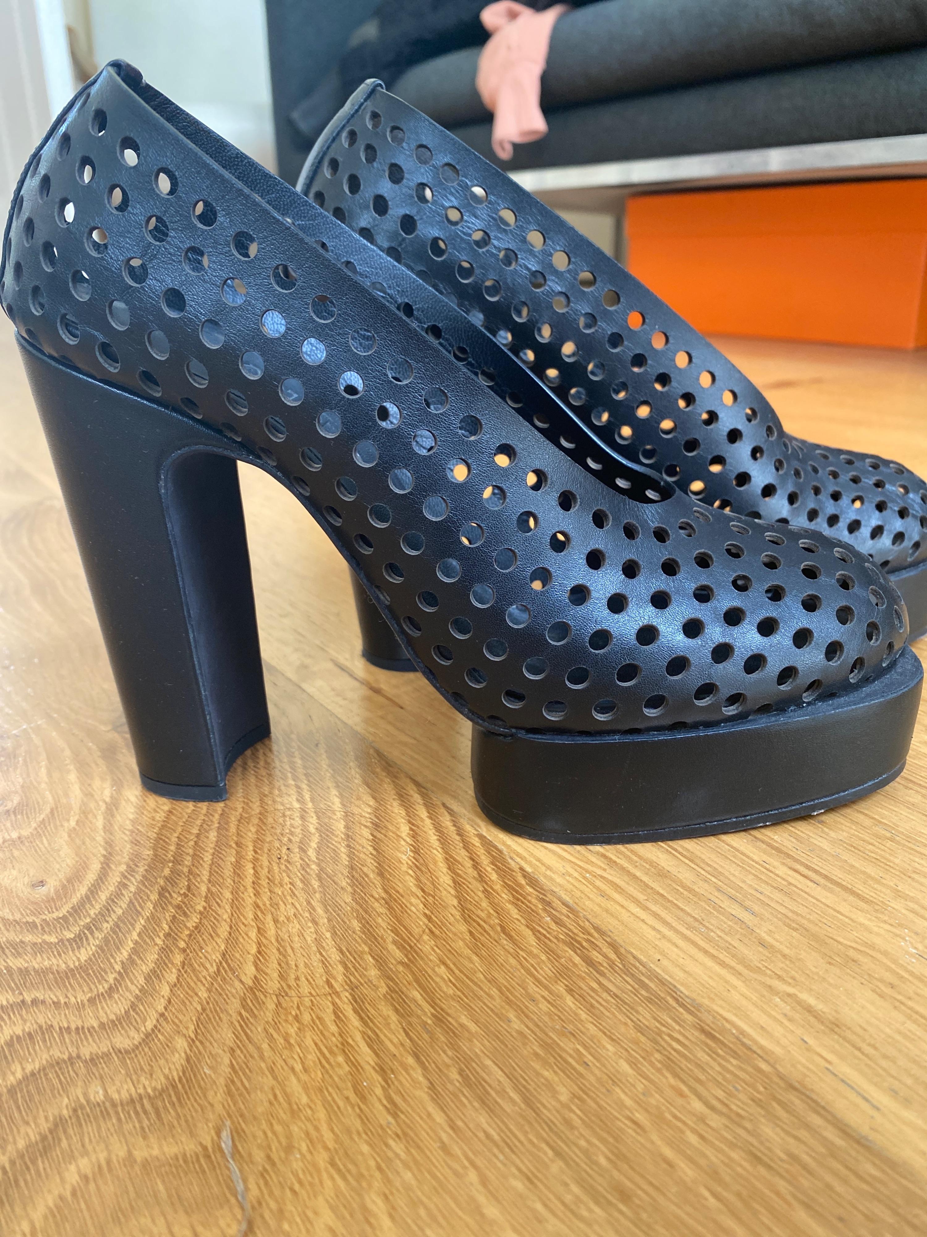 Black perforated leather platform heeled pumps