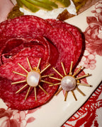 Pendientes en forma de sol con perlas