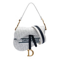 Perforated Oblique Embossed Calfskin Saddle Bag