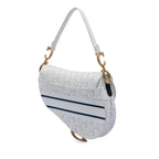 Perforated Oblique Embossed Calfskin Saddle Bag