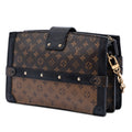 Monogram Reverse Trunk Clutch
