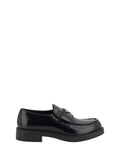 Prada Enameled Triangular Logo Loafer — Black