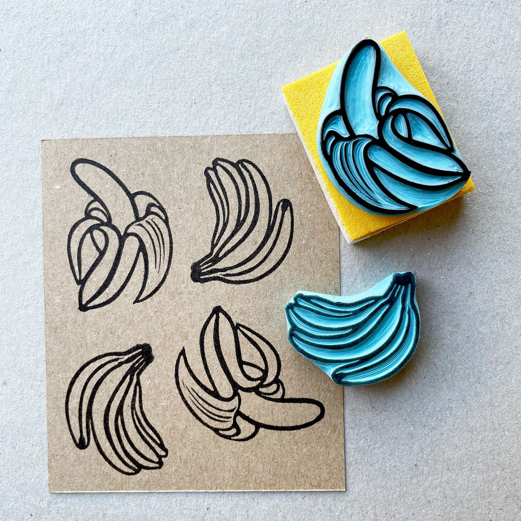 Banana rubber stamps, peeled banana and a banana bunch