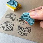 Banana rubber stamps, peeled banana and a banana bunch