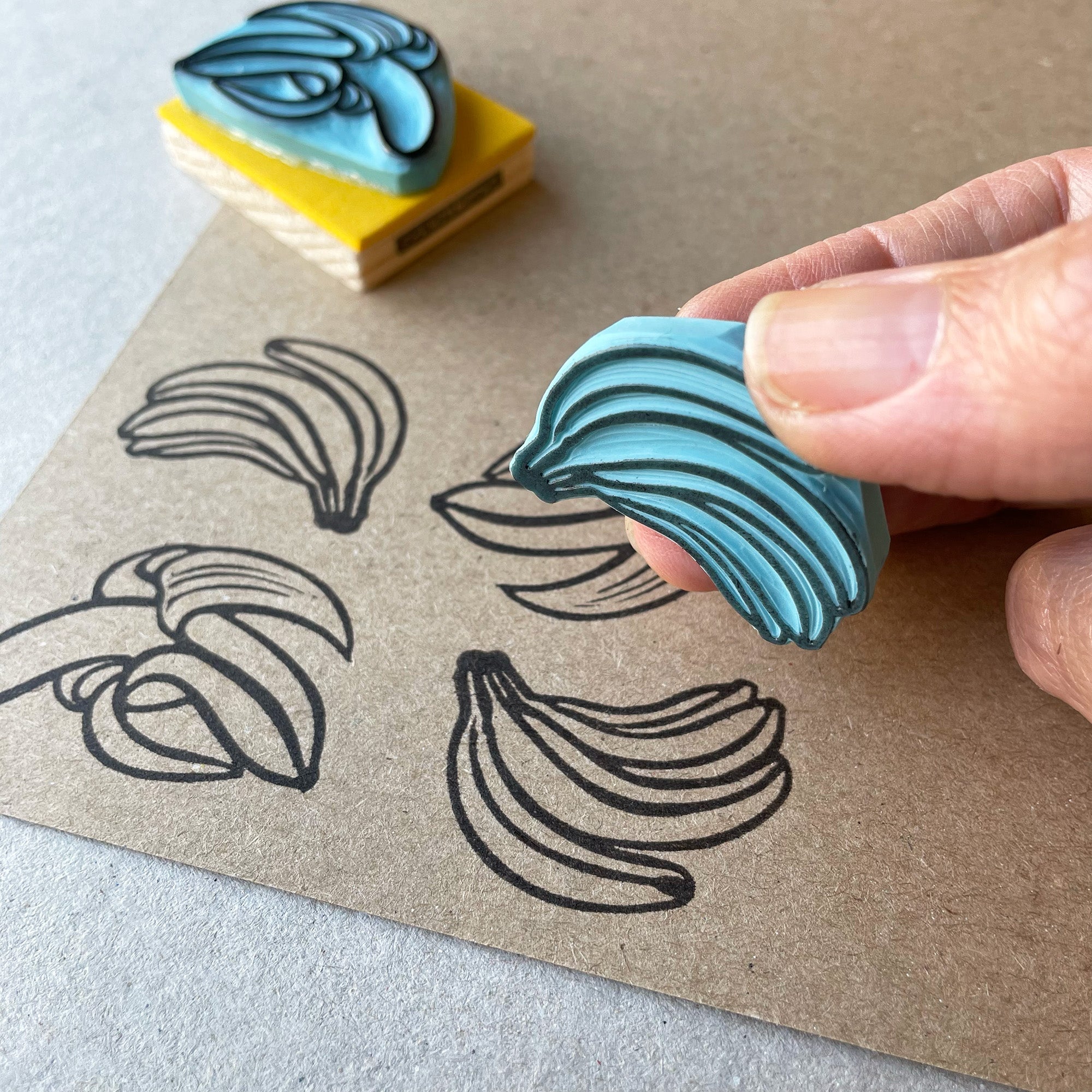 Banana rubber stamps, peeled banana and a banana bunch