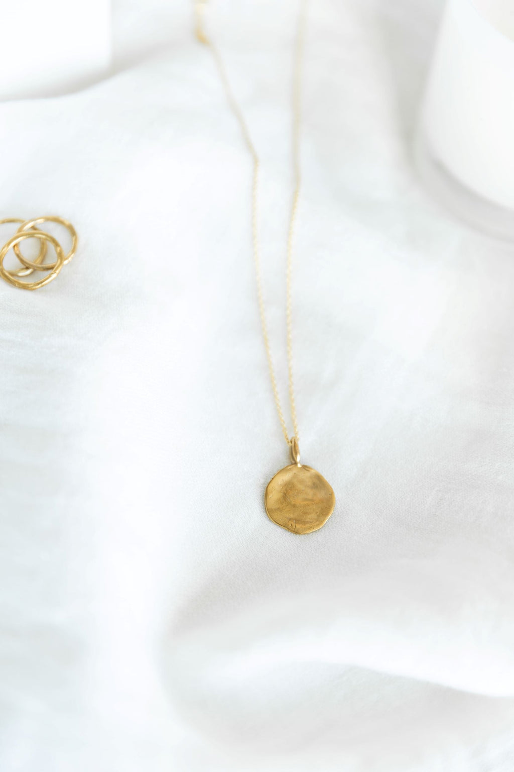 COLGANTE MONEDA IRREGULAR | BRONCE