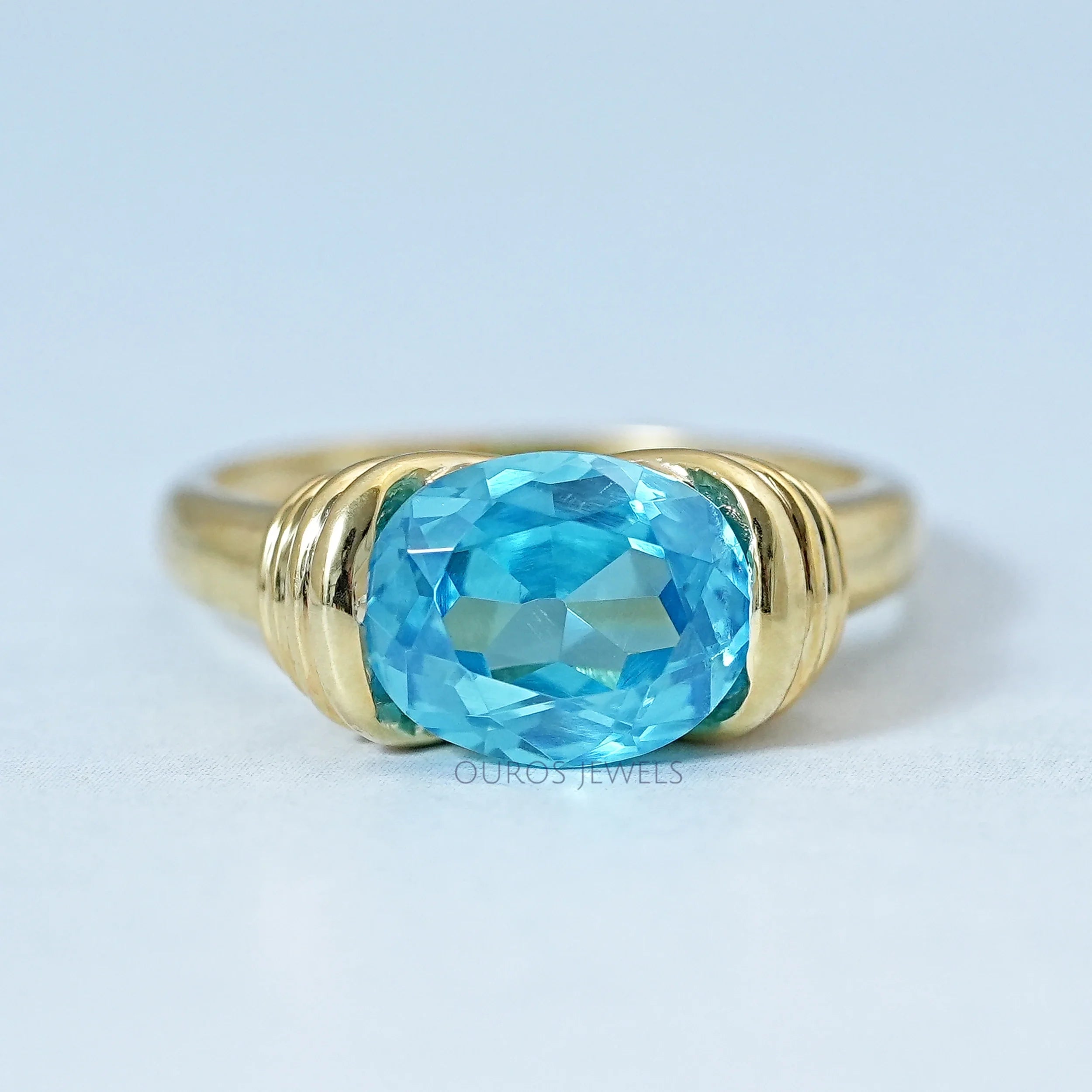 East-West Blue Oval Gemstone Solitaire Ring