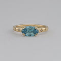 East-West Blue Step Cut Oval Accent Diamond Ring