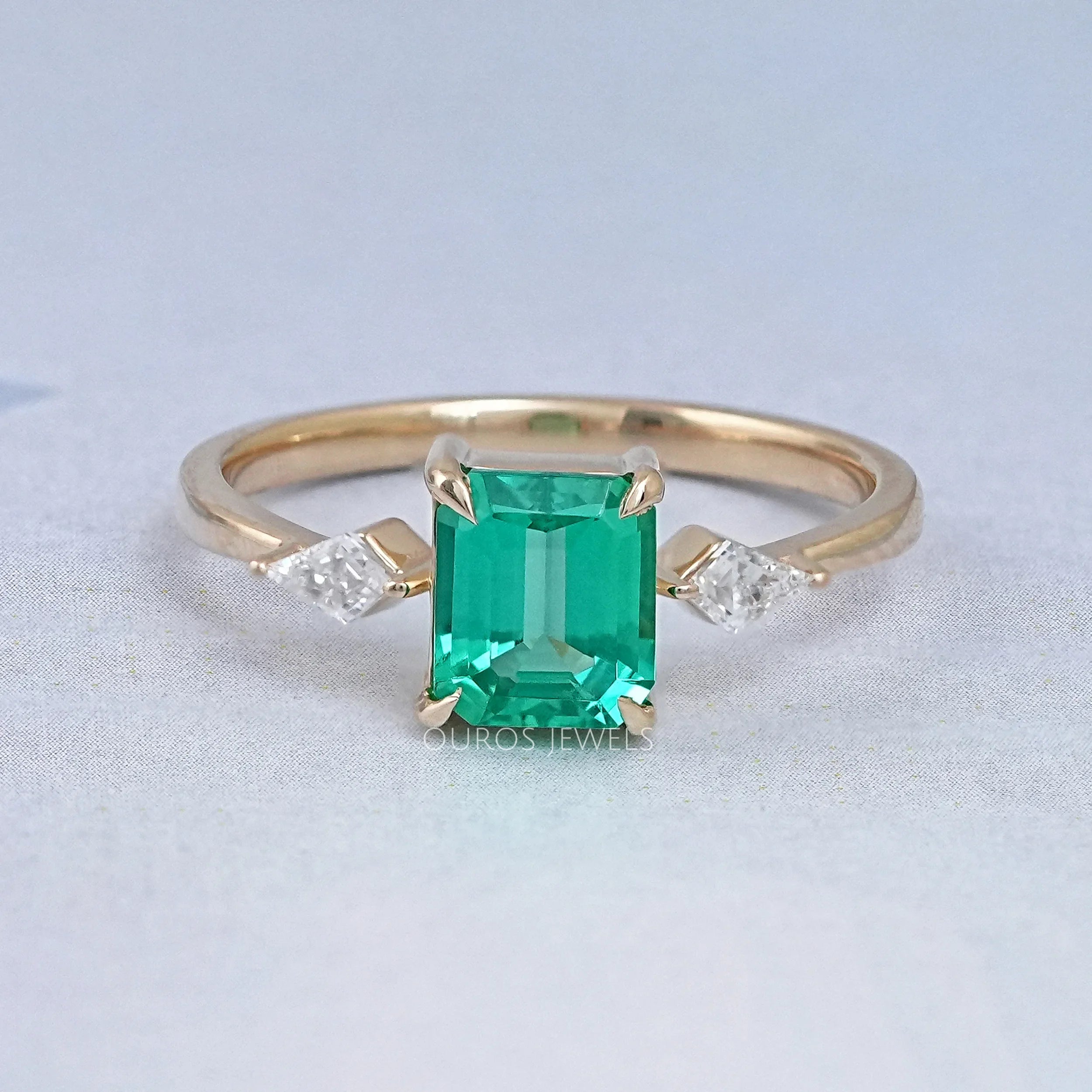 Emerald Gemstone And Kite Cut Three Stone Engagement Ring