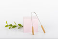 Raspador lingual de madera y acero inoxidable