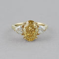 Fancy Vivid Yellow Oval Cut Hidden Halo Three Stone Ring