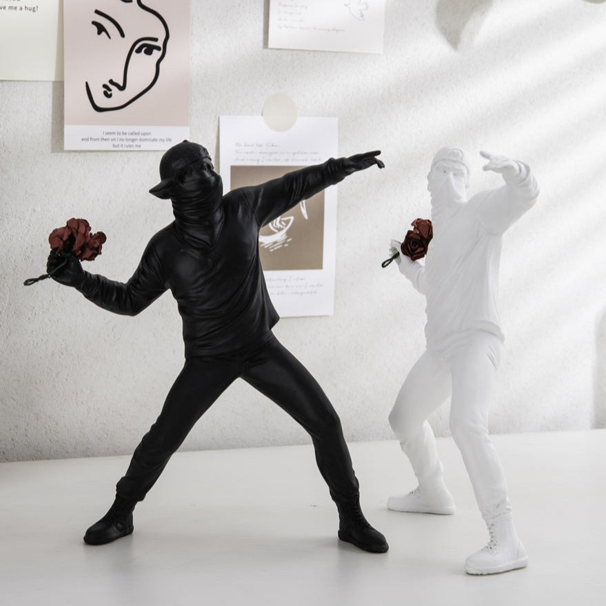 ArtZ® Man Throwing Flowers Sculpture - Set of 2 (1 White and 1 Black)