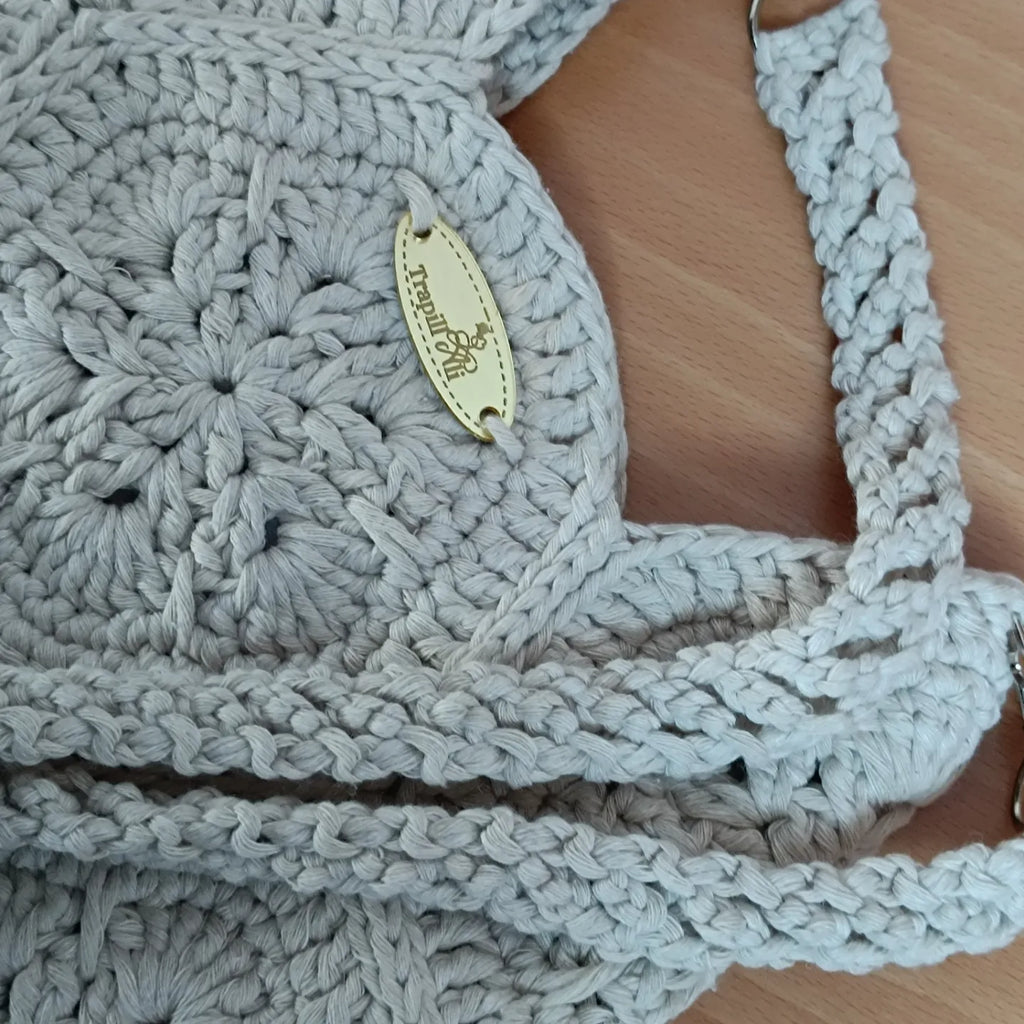 Bolsito flor africana