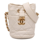 Mini Quilted Caviar Twist Your Buttons Drawstring Bucket Bag