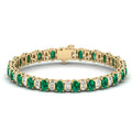 Alternating Oval Emerald and Baguette Diamond Bangle