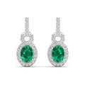 Oval Emerald and Halo Diamond Dangle Drop Earrings