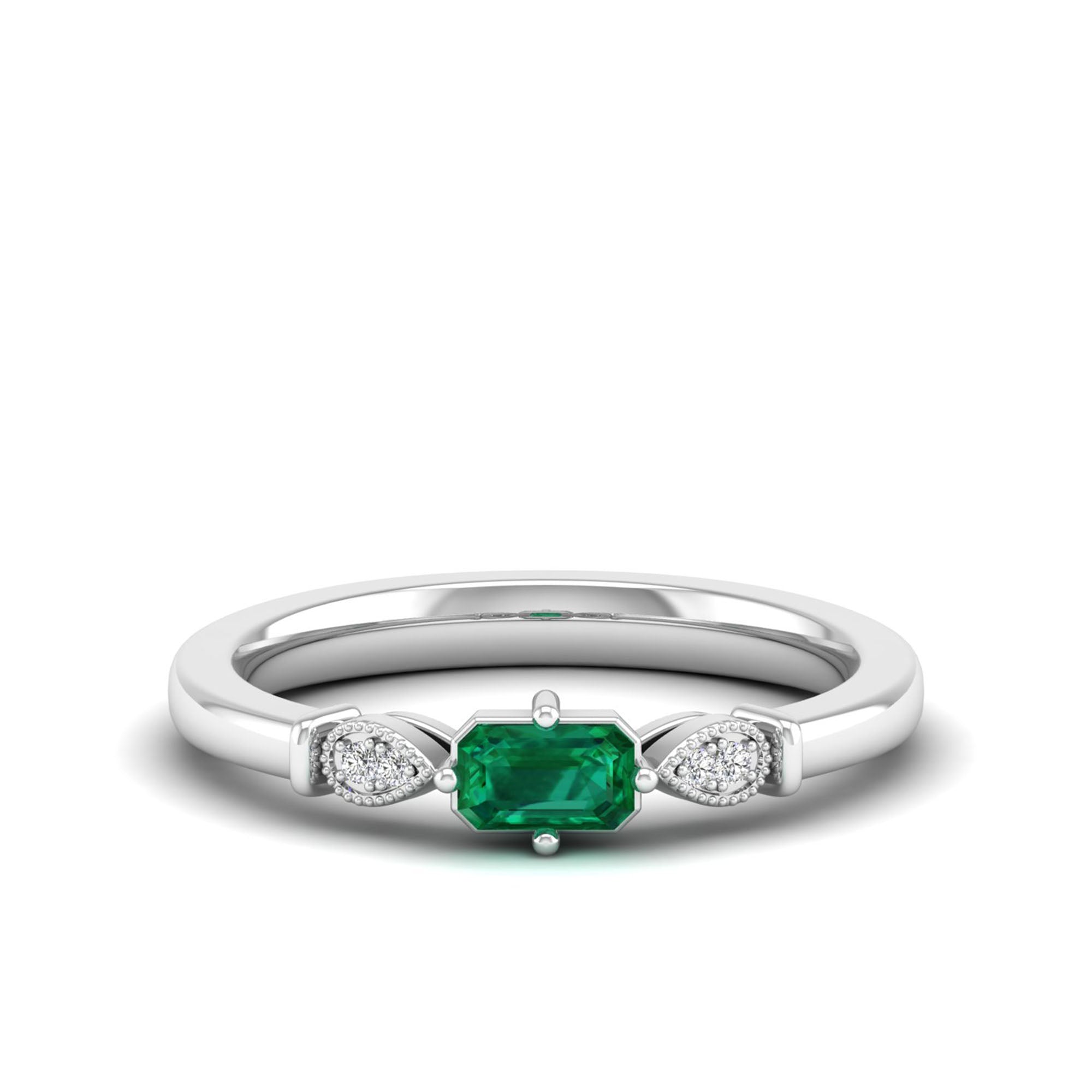 East-West Emerald and Filligree Diamond Ring