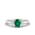 Prong Oval Emerald and Bezel Diamond Ring