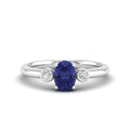 Prong Oval Tanzanite and Bezel Diamond Ring
