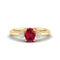 Prong Oval Ruby and Bezel Diamond Ring