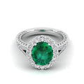 Oval Emerald Shared Prong Halo Diamond Ring