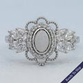 Opal Oval Cut And Halo Diamond Floral Engagement Ring