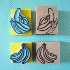 Banana rubber stamps, peeled banana and a banana bunch