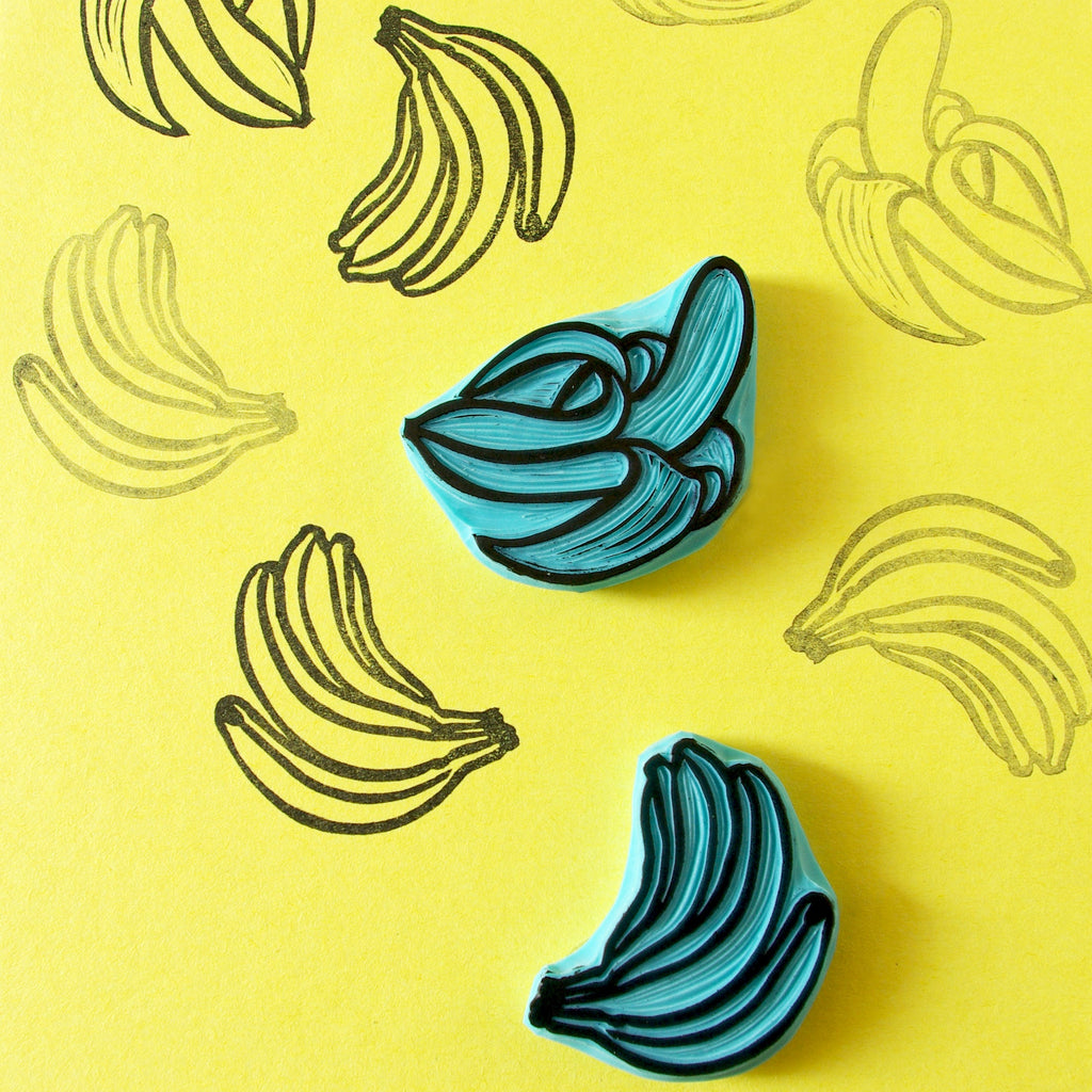 Banana rubber stamps, peeled banana and a banana bunch