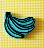 Banana rubber stamps, peeled banana and a banana bunch