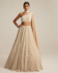 Light Beige Dense Mirror And Pearl One Shoulder Lehenga Set By KYNAH, Luxury Indian Fashion & Bridal Wear