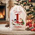 Personalizado lindo muñeco de nieve Reno Santa Claus Bolsa de regalo de lona de cordón con el nombre y el año Primera Navidad Fiesta de Favores para el bebé