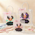 Bolsa de regalo transparente personalizada con nombre y lazo para niña de color negro