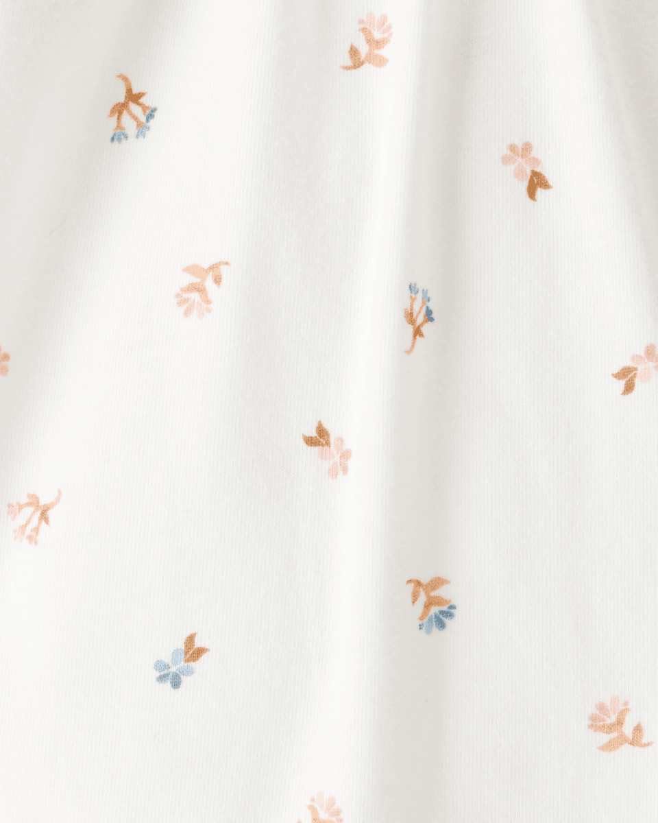 Body de manga larga floral con cuello de volantes en algodón