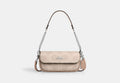 COACH® Women's Bolso con solapa Hailey de lona de firma en Beige | Pvc