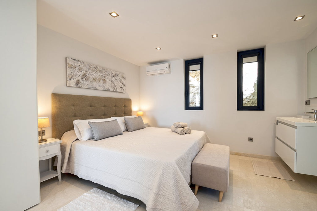Hillside Contemporary Style Ibiza Villa with Panoramic Views of the Island near Cala Roja Cove and Talamanca Beach in Ibiza Town