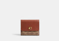 COACH® Women's Cartera Mila con solapa pequeña en lona de firma en Castaño/beige | Pvc