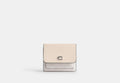 COACH® Women's Cartera Mila con solapa pequeña en lona de firma en Blanco | Pvc