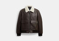 COACH® Men's Chaqueta De Vuelo De Piel Con Cuello De Borreguillo en Castaño, Talla Mediano | Cuir
