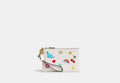 COACH® Women's Bolso Pouch Pequeño Básico Con Estampado De Pegatinas en Blanco | Cuir