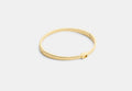 COACH® Women's Brazalete Fino Con Bisagra De Firma en Amarillo/gold | Métal
