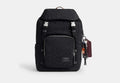COACH® Men's Mochila Logan En Nylon De Firma Con Charms en Negro